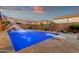 Relaxing backyard oasis featuring a sparkling pool with fountains, diving board, and desert landscaping at 5223 W Bent Tree Dr, Phoenix, AZ 85083