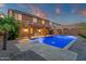 Backyard featuring a stunning private pool with water features, diving board and outdoor lighting at 5223 W Bent Tree Dr, Phoenix, AZ 85083