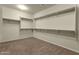 Spacious walk-in closet with multiple shelves and rods providing ample storage space at 5223 W Bent Tree Dr, Phoenix, AZ 85083