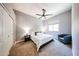 This stylish bedroom features neutral walls, carpeting, and side tables at 5416 W Village Dr, Glendale, AZ 85308