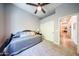 A neutral toned bedroom provides a daybed and easy access to the kitchen at 5416 W Village Dr, Glendale, AZ 85308