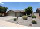 Attractive single-Gathering home boasting a three-car garage and easy-care desert landscaping at 5416 W Village Dr, Glendale, AZ 85308