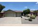 Charming single-Gathering home featuring a three-car garage and meticulously maintained desert landscaping at 5416 W Village Dr, Glendale, AZ 85308