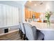 Stylish kitchen featuring a breakfast bar, stainless steel appliances, and wood cabinets at 5416 W Village Dr, Glendale, AZ 85308