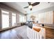 Bright living room with hardwood floors, ceiling fan, and comfortable seating arrangement at 5416 W Village Dr, Glendale, AZ 85308