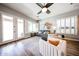 Bright living room with hardwood floors, ceiling fan, and comfortable seating arrangement at 5416 W Village Dr, Glendale, AZ 85308