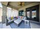 Serene covered patio with comfortable sectional seating and view of the backyard pool at 5416 W Village Dr, Glendale, AZ 85308
