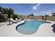 Backyard with an inviting pool area, lush greenery and ample space for outdoor relaxation at 5416 W Village Dr, Glendale, AZ 85308