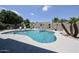Backyard with an inviting pool area, lush greenery and ample space for outdoor relaxation at 5416 W Village Dr, Glendale, AZ 85308