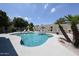 Backyard with an inviting pool area, lush greenery and ample space for outdoor relaxation at 5416 W Village Dr, Glendale, AZ 85308