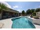 Lush backyard oasis features pool with waterfall, connected to outdoor living with ample seating for elegant relaxation at 5416 W Village Dr, Glendale, AZ 85308