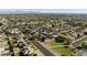 A suburban aerial shows a park and residential area featuring single-story homes with mature trees at 5602 N 73Rd Ave, Glendale, AZ 85303