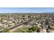 Aerial view of a well-planned community with a park and tree-lined streets at 5602 N 73Rd Ave, Glendale, AZ 85303