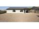 Spacious backyard featuring a covered patio, gravel landscaping and block fence at 5602 N 73Rd Ave, Glendale, AZ 85303