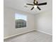 Charming bedroom with natural light from a large window and modern ceiling fan and light at 5602 N 73Rd Ave, Glendale, AZ 85303