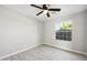 Bright bedroom features wood-look flooring, large window, and a modern ceiling fan with light at 5602 N 73Rd Ave, Glendale, AZ 85303