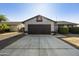 Traditional home featuring a spacious driveway and two-car garage at 5602 N 73Rd Ave, Glendale, AZ 85303