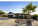 Attractive home featuring desert landscaping, mature shrubs, and a private two-car garage at 5602 N 73Rd Ave, Glendale, AZ 85303