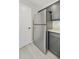 Kitchen with a stainless steel refrigerator, gray cabinets and granite countertops at 5602 N 73Rd Ave, Glendale, AZ 85303