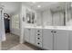 Double sink vanity offers abundant storage and lighting at 5659 N 195Th Dr, Litchfield Park, AZ 85340