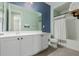 Fresh bathroom features white vanity, modern fixtures, and stylish blue and green color scheme at 5659 N 195Th Dr, Litchfield Park, AZ 85340
