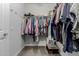 Walk-in closet boasts plenty of organizational opportunities at 5659 N 195Th Dr, Litchfield Park, AZ 85340