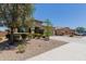 Beautiful home with manicured landscaping, a two-car garage, and a welcoming entrance at 5659 N 195Th Dr, Litchfield Park, AZ 85340