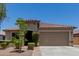 Charming single-story home with a well-manicured front yard and a neutral color scheme at 5659 N 195Th Dr, Litchfield Park, AZ 85340