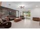 Spacious living room boasts a wood accent wall and sliding doors to the backyard at 5659 N 195Th Dr, Litchfield Park, AZ 85340