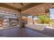 Covered outdoor patio area with pavers, a pergola, and a built-in grilling area at 5659 N 195Th Dr, Litchfield Park, AZ 85340