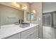 Beautiful bathroom featuring a stylish vanity with a stone vessel sink and decorative mirror at 620 S Allred Dr, Tempe, AZ 85288