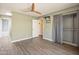 View of a bedroom with vinyl wood floors and an ensuite bathroom, with a view of an adjacent room at 620 S Allred Dr, Tempe, AZ 85288
