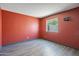 Bedroom featuring wood floors, neutral paint, and window at 620 S Allred Dr, Tempe, AZ 85288