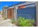 Charming gated entrance with wood and blue accents surrounded by lush landscaping at 620 S Allred Dr, Tempe, AZ 85288