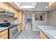 Updated kitchen featuring stainless steel appliances and gray countertops at 620 S Allred Dr, Tempe, AZ 85288