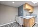 Updated kitchen showing gray counters, tile backsplash and access to appliances at 620 S Allred Dr, Tempe, AZ 85288
