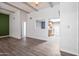 Bright living room showing beamed ceiling, wood floors and view into updated kitchen at 620 S Allred Dr, Tempe, AZ 85288