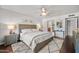 Bright bedroom with a queen bed, bedside tables, and plush rug on hardwood flooring at 6715 S Lakeshore Dr, Tempe, AZ 85283