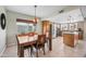 Cozy dining area adjoining the kitchen, featuring a wooden table, chairs, and natural light at 6715 S Lakeshore Dr, Tempe, AZ 85283