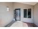 Front door close-up featuring a black ornamental security screen at 6715 S Lakeshore Dr, Tempe, AZ 85283