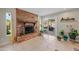 Living room features a brick fireplace, sliding doors to patio, and abundant natural light at 6715 S Lakeshore Dr, Tempe, AZ 85283