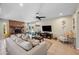Comfortable living area featuring a brick fireplace, cozy seating, and sliding glass doors to the outdoor space at 6715 S Lakeshore Dr, Tempe, AZ 85283