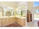 Well-lit bathroom with dual vanities and direct access to an outdoor balcony at 7115 E Buena Terra Way, Paradise Valley, AZ 85253