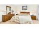 Cozy bedroom with matching furniture and a floral bedspread and decorative art and lamps at 7115 E Buena Terra Way, Paradise Valley, AZ 85253