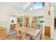 Bright dining room with vaulted ceiling, large windows, and an elegant chandelier above the dining table at 7115 E Buena Terra Way, Paradise Valley, AZ 85253