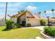 Charming home featuring a well-maintained lawn, mature landscaping, and a two-car garage at 7115 E Buena Terra Way, Paradise Valley, AZ 85253