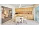 Bright kitchen with wooden cabinets, black appliances, and breakfast table at 7115 E Buena Terra Way, Paradise Valley, AZ 85253