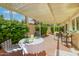 Charming covered patio featuring comfortable seating and lush greenery, perfect for outdoor relaxation and dining at 7115 E Buena Terra Way, Paradise Valley, AZ 85253