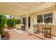 Inviting covered patio with shade, patio furniture, and views of lush greenery, perfect for outdoor entertaining at 7115 E Buena Terra Way, Paradise Valley, AZ 85253