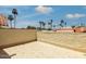 Spacious outdoor patio featuring tile flooring, decorative walls, and palm tree views, ideal for relaxing and entertaining at 7115 E Buena Terra Way, Paradise Valley, AZ 85253